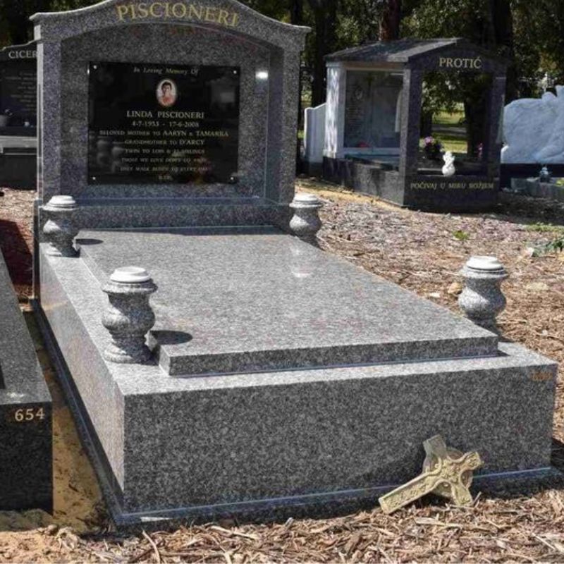 kerbed granite tombstone